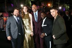 He is acting as a fake actor in a fake movie who has fallen in love with his girlfriend's grandmother. Jumanji Continues To Stomp N American Box Office Competition