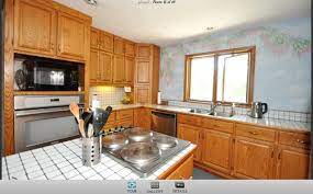 Kitchen cabinets of this kitchen all uses solid oak wood in its natural color, topped with light gray granite counter top. Oak Cabinets What Countertop And Backsplash