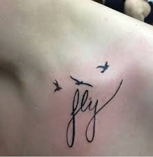 Pin By Maddie Buko On Tats Flying Tattoo Tattoos Ribbon Tattoos