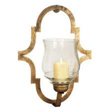 Decorative wall sconces for pillar candles, meanwhile, might lend more of a modern flair with a matte black finish and sleek glass cylinder hurricanes. Gold Quinn Quatrefoil Sconce Sconces Crystal Wall Sconces Quatrefoil