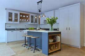 blue kitchen with gray countertops