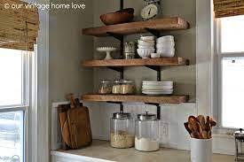 Rustic shelving for modern kitchen. Want Love This Vintage Inspired Kitchen Reclaimed Wood Kitchen Kitchen Wall Shelves Wood Shelves