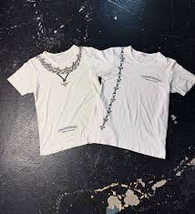 Comme des garçons x chrome hearts A rare collaboration from two extremely  sought after brands, featuring comme des garçons blanks with oversized  printed chrome hearts jewelry on them, these tees are from