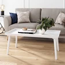 Instead, it should have as much style and presence as any of your home's decor. Nathan James Hazel 41 In White Large Rectangle Wood Coffee Table With Narrow Cone Legs 31601 The Home Depot
