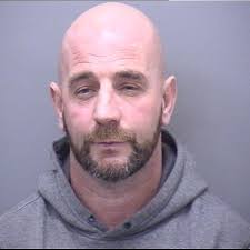 Poole man grabbed police officer's genitals and spat at him