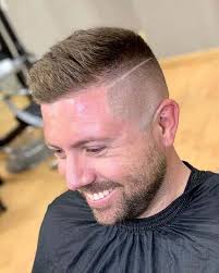 This style features a sharp bald fade and two razor cut lines on the sides with longer locks down the. 10 Cool Men S High Skin Fade Haircut Trends To Follow In 2021 Hmobilebarber Com