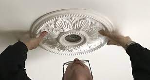 Basically, personal taste dictates the overall size of a ceiling medallion, but the rule of thumb is that the ceiling medallion should be about the same size as the chandelier, and the chandelier's size is based on half the width of the dining room table that it will hang above. Ceiling Medallions In The Dining Room And Entry Project Small House