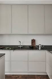 One Of Our Light Grey Minimalist Kitchens A Modern Yet Timeless Design In This Scandinavian Home Mo Minimalist Kitchen Design Beige Kitchen Kitchen Interior