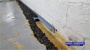 How to install a french drain around basement. French Drain Systems Basement Waterproofing Solutions