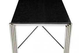 The dark gray colorway is perfect for versatile decor, whether used as extra seating, an ottoman, or a side table with a tray perched on top. Jaipur Round Nickel Coffee Table Black Granite Top Serene Furnitureinstore