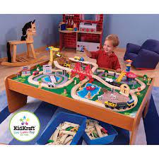 A helicopter and airplane pass by overhead. Kidkraft Ride Around Town Train Table And Set 100 Piece Fao Schwarz Kids Playroom Train Set Table Wooden Train Set