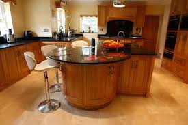 The kitchen island breakfast bar is an all wood kitchen island with a two door cabinet and four drawers. Kitchen Island Breakfast Bar Curved Curved Bespoke Oak Kitchens By Anglo Kitchens Northampton Round Kitchen Island Kitchen Island Bar Breakfast Bar
