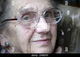 Harry Farr's daughter 92 year old Gertrude Farr holding a photograph of her  father Stock Photo