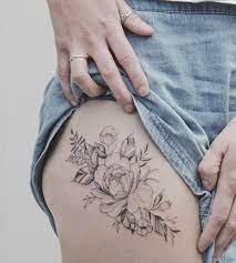 Floral thigh tattoos are large as thighs provide a lot of space for large tattoos. Tattoo Thigh Flower Fineline By Tritoan Ly Flower Thigh Tattoos Floral Hip Tattoo Floral Thigh Tattoos