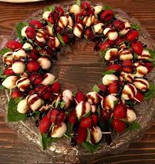 A perfect christmas party spread includes a variety of hot and cold savory apps, a warming soup and some sweet treats to round out your array. Awesome Festive Caprese Wreath Great For Holidays Or Any Occasion This Is Super Simple To Make And Dri Holiday Appetizers Christmas Food Christmas Appetizers