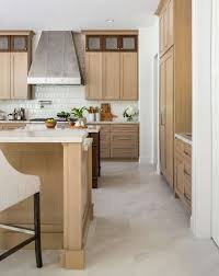 To ensure the pattern stands out, the designer used glass open shelving instead of upper cabinets. Kitchen Makeover Goodbye Old Oak Cabinets Hello New Before And After Designed