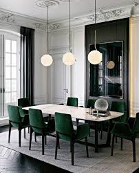 The dining table features dark wood, contrasting with the light shade of the kitchen, and is wrapped in grey fabric upholstered chairs. Velvet Upholstery Fabrics For Dining Chairs