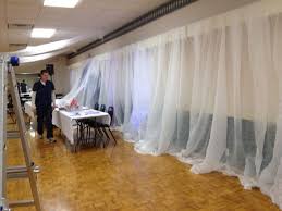 For Weddings This Wall Is Being Covered In Tobacco Cloth It Is A Wonderfully Affordable Alternative To Diy Wedding Arch Tulle Backdrop Wedding Arch Tulle