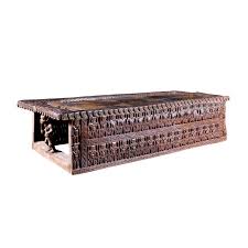 On forged metal base in brass finish. Royal Cameroon Bed Carved African Coffee Table Symbolic Bed