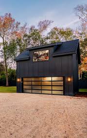 Ultra Modern All Black Detached Garage With Double Wide Door And Living Space Detached Garage Detached Garage Designs Modern Garage Doors