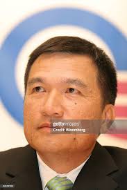 Michael Wang, President of Quanta Computer Inc., smiles during a news...  News Photo