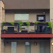 Scatter seasonal blooms around your outdoor sofa or bistro table. 36 Planters On Balcony Rails Modern Rail Planter