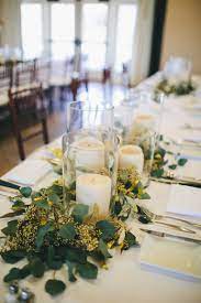 1 2 Of The Table Centerpieces Will Be Clusters Of Pillar Candles In Vases And Go Glass Wedding Centerpieces Mercury Glass Wedding Centerpieces Floating Candles