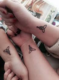 Celtic Symbols Mother Daughter Tattoos Wrist Tattoos Three Hands In 2020 Tattoos For Daughters Celtic Knot Tattoo Knot Tattoo