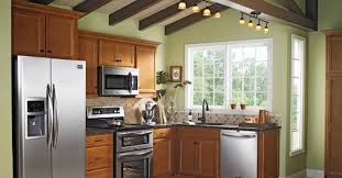 Cabinets medium size sage light green brown decorating walls color. Maple Cabinets With Light Sage Green Paint On The Walls Black Granite Pretty Lighting And Stainless Stee Brown Kitchen Cabinets Wood Kitchen Kitchen Remodel
