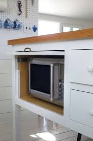 Contemporary kitchen cart, multifunctional design with slatted shelves, whiteby decor love. 11 Strategies For Hiding The Microwave Remodelista