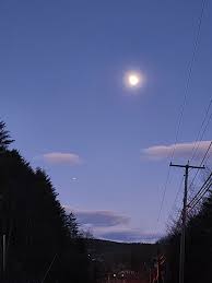 A Full Moon with Jupiter below and to the left in the Northeast sky over  Springfield as viewed from Chester Road