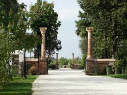 A man open the door and comes out of the building. Gate Columns Palace Mogosoaia Castle Free Pictures Free Image From Needpix Com