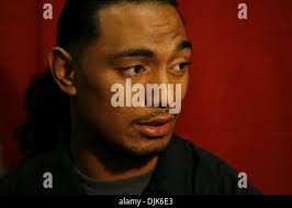 Utah running back Matt Asiata, right, carries the ball in for a touchdown  after catching a pass in front of Wyoming linebacker Weston Johnson, left,  during the third quarter of Utah's 40-7
