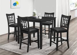 Tuck a round table with a pedestal base into a corner for a snug eating area. 7855 5pc 5 Pc Winston Porter Charlene Black Finish Wood Counter Height Dining Table Set