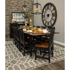 If you want an ageless aesthetic, consider a wood dining table in a black finish. Black Dining Room Table Wild Country Fine Arts