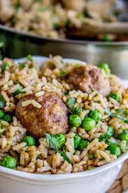 One Skillet Beef Meatballs With Rice And Peas From The Food Charlatan Recipes Cookbook Menu Homemade Meatballs And Rice Meatball Dishes Food Recipes