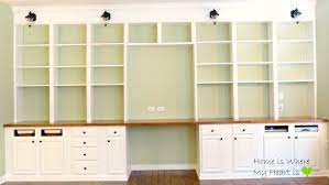 The drawers and filing cabinets give you plenty of storage. Remodelaholic Build A Wall To Wall Built In Desk And Bookcase