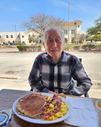 I'm picking up a friend from the airport next week. Where can we go for  lunch that serves great seafood?