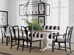 Black And White Striped Bench Decor In Black And White With Trestle Table Striped Bench And Green Bottle Accents Bu White Dining Room Table White Dining Room Black And White Dining Room