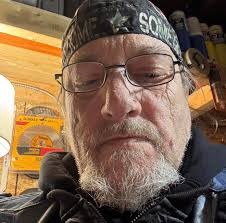 Napa employee with Camero and Firebird parts