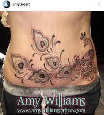 They come in many artistic designs and can be changed as often as one likes. Dotwork Peacock Scar Coverup Stomach Tattoo By Amy Williams Blackwork Stippling Pontillism Bird Geometric Tattoos For Women Stomach Tattoos Trendy Tattoos