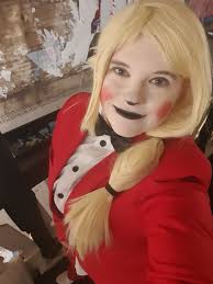 Here's who I'll be cosplaying this year. It's Charlie from Hazbin hotel.  I'm very excited to dress like her this. She so much fun and I can't wait  to see you guys