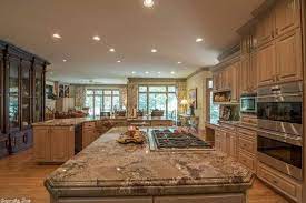 Typhoon bordeaux granite countertop with matt antique sienna stained cherry cabinets ,custom made and painted backsplash and light oak flooring. Typhoon Bordeaux Granite Natural Beauty In Your Kitchen