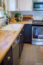 Kitchen Update Dark Grey Lower Cabinets White Upper Cabinets Butcher Block Counter Top Updated Kitchen White Upper Cabinets White Upper Cabinets Grey Lower