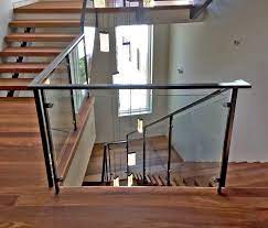 Low angle view of stairs leading towards modern building. Glass Handrail Systems Residential Gallery Anchor Ventana Glass