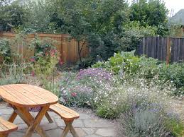 Cheery picnic table, front yard living, knowing the people who can loan a cup of sugar. Edible Gardens