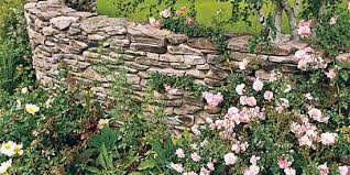 Rubble wall a rubble wall is made of stone of random sizes and shapes fitted tightly together when stacked. Stone Wall Ideas Better Homes Gardens
