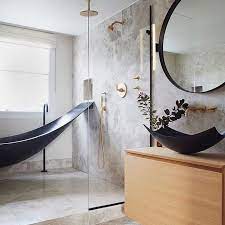 A Bold Bathroom That Oozes Tranquility With The Use Of Natural Materials A Touch Of Brass And The High Tech Ma Bold Bathroom Bathroom Design Bathrooms Remodel