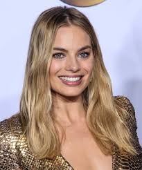 She has been nominated for various awards, including two academy awards. Margot Robbie Long Wavy Honey Blonde Hairstyle