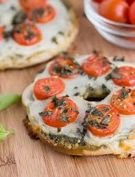 Margherita Pizza Bagel Rethink Pizza Night With These Mini Margherita Pizzas Made On Plain Thomas Bagels Pesto Mozzarella Tomato Pizza Bagels Recipes Food